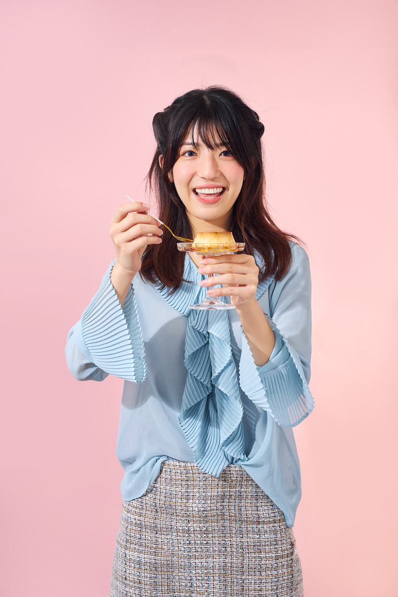 Smiling Woman Eating Purin